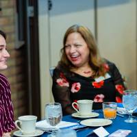 Student and donor sitting at a table at Scholarship Dinner 2019